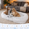A human-specific dog bed featuring a washable faux fur design